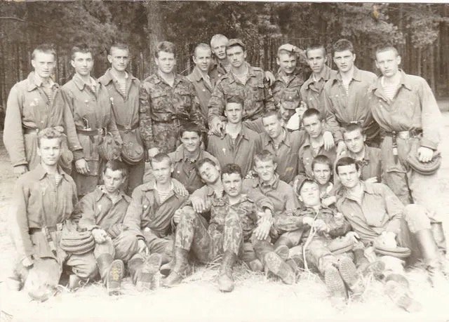 Group photo, camouflage and jumpsuit mix