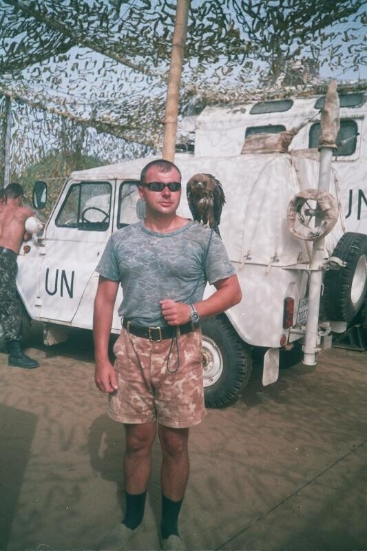 Ukrainian peacekeeper with UN colored vehicles