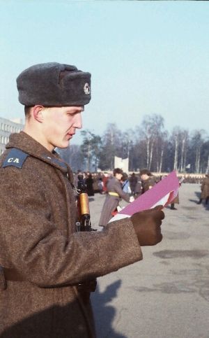 Soviet paratrooper recruit in greycoat and gloves