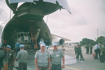 Ukrainian peacekeepers unloading helicopters from an airplane 