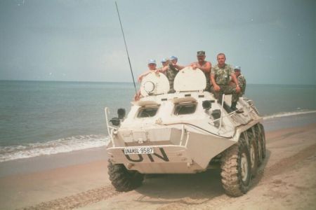 Ukrainian peacekeepers riding BTR on a beach 