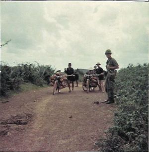 Lanny Hale Vietnamese With Bikes Loaded Down